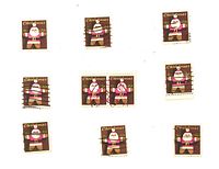 Nine singles and one attached pair of cancelled 1979 15¢ Christmas stamps on white background
