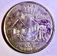 Reverse of Iowa quarter showing schoolhouse scene and legends