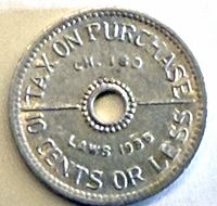 Reverse view showing legend TAX ON PURCHASE CH.180 LAWS 1935 10 CENTS OR LESS and central hole