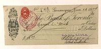 Front of 1924 Bank of Toronto draft showing engraving, red war tax stamp, handwriting