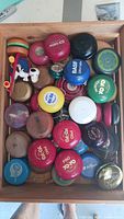 Top view of wooden box showing full assortment of yo-yos and Snoopy skateboard figure
