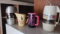 All four branded drink containers grouped
