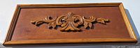 Front view showing entire carved wood panel
