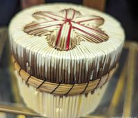 Angled view showing body construction, sweetgrass band and quill work