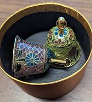 Pair of bells in round box interior view