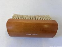 Side view of brush showing horsehair bristles and Ralph Lauren logo