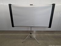 Front view of fully assembled projection screen on tripod