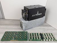 All four items: Antminer S3, power supply, two circuit boards