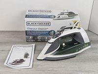 Full lot view showing iron, box, manual