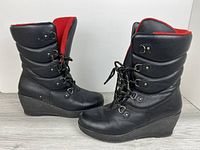 Left and right boots side view showing exterior and wedge heel
