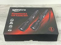 Box front showing two flashlights and brand