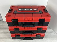 Front view of three stacked Einhell E-Tower tool cases