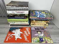 Two stacks of assorted books with Dr. Seuss and Willy Nilly shown front