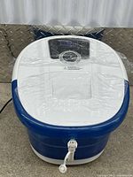 Full view of MaxKare foot spa showing blue/white tub and controls