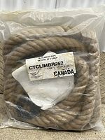 Front view of coiled rope in plastic with label visible