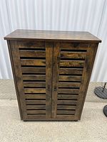 Front view showing louvered double doors and finish