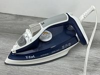 Left side view showing body, handle, controls and cord