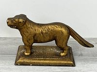 Profile of brass dog nutcracker on base