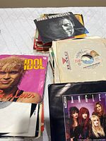 Stack of 45s with visible Bruce Springsteen, Billy Idol, Bangles sleeves