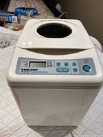 Front and top view of breadmaker showing overall condition and viewing window