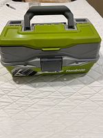 Closed green and gray Flambeau tackle box