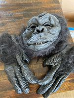 Mask and gloves laid out on surface