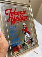 Front view of Johnnie Walker mirror sign showing graphic and overall condition