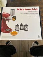 Retail box showing KitchenAid Fresh Prep Slicer/Shredder image and branding