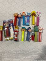 Group shot of all 14 dispensers, sealed Santa visible
