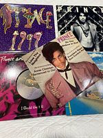 Group shot of five Prince records displaying front covers