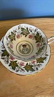 Interior of Paragon cup and saucer showing E & D monogram, floral design, gilt edge
