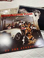 Grandmaster Flash and The Furious Five LP with partial view of Foreigner and Roger Daltrey jackets