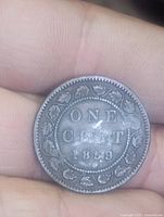 Reverse of 1859 Canadian large cent showing ONE CENT 1859 within maple wreath