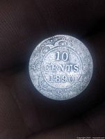 Reverse side showing 10 CENTS 1890 within ornate border
