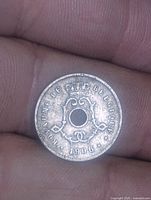 Obverse view showing crowned monogram, date 1906, full legend