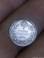 Reverse side showing 5 CENTS CANADA 1917 with crown and maple leaf wreath