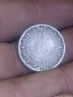 Obverse showing 1936 date, 10 Centavos value, Aztec border