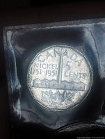 Reverse of 1951 Canada 5-cent coin showing Nickel 1751-1951 design