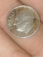 Obverse of 1960 Roosevelt dime showing LIBERTY, IN GOD WE TRUST and date