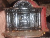 Close-up of front relief showing Georgian house columns and central panel