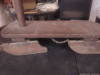 Side view of sled showing platform, steering post, and runners