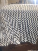 Full view of blanket draped, showing chevron pattern