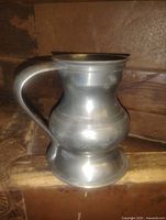 Side view of pewter tankard showing form and handle