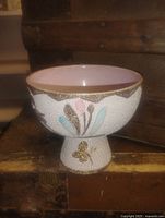 Side view of ceramic pedestal bowl showing exterior design and foot