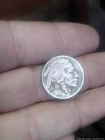 Obverse showing Native American profile and 1935 date