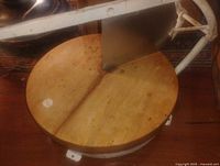 Top view showing round maple block and attached metal blade