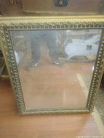 Full view of mirror showing frame detail and overall condition