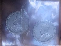 Obverse sides showing King George V portraits