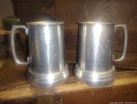 Front view of both pewter tankards
