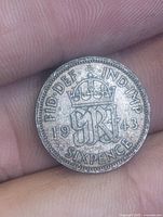Reverse of 1943 sixpence showing crowned monogram and date